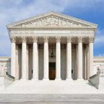 Supreme Court Slaps Down Trump Order Front view of the Supreme Court building with large columns and steps under a blue sky