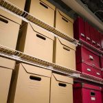 GOP Exodus SPARKS 2026 House Chaos Shelves filled with brown and red storage boxes for organizing documents