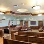Pregnant Girlfriend’s Last Words Stun Court Empty courtroom with wooden benches and judge's bench