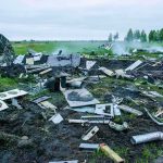 B-52 Disaster—Crash Confirmed After Takeoff Aircraft crash debris scattered across a grassy field