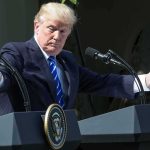 Trump Pushes Lindsey’s Sister Into Senate Donald Trump speaking at dual podiums with arms outstretched