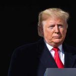 9/11 ‘Man in the Red Bandana’ Receives Medal of Freedom Donald Trump at a podium with a microphone