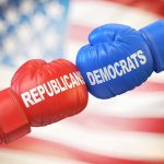 Boxing gloves labeled Republicans and Democrats bump together