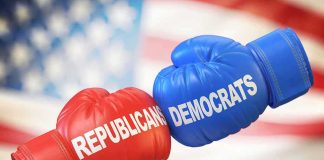 Boxing gloves labeled Republicans and Democrats bump together