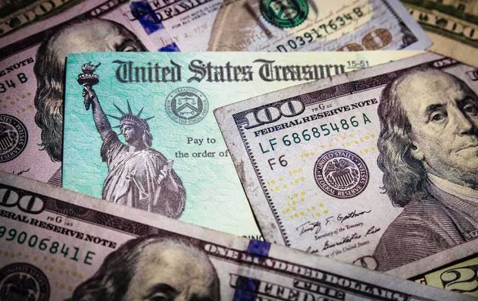 United States Treasury check on top of US dollar bills