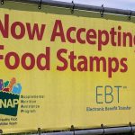 Yellow banner announcing acceptance of food stamps and EBT