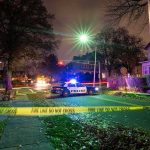 Deadly Gunfight Erupts in Minnesota Police car blocks residential street at night behind caution tape