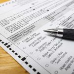Trump Takes Mail-Ballot Fight Back to SUPREME COURT Ballot paper with pen on wooden surface