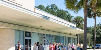 People lined up outside a building to vote