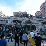 Citywide Blasts Pound Kyiv Overnight Rescue workers and civilians on collapsed building after earthquake