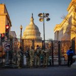 White House UFC Plot EXPOSED National Guard troops stand at a security fence near the U.S. Capitol