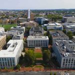 FBI Raids Jolt Michigan Campus aerial view of a university campus quad with surrounding academic buildings
