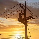 Venezuela Hopes To Restore Power Grid That Socialist Hugo Chávez Destroyed Utility workers on power poles at sunset