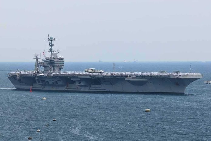 shutterstock_1984534982-1 Aircraft carrier sailing at sea