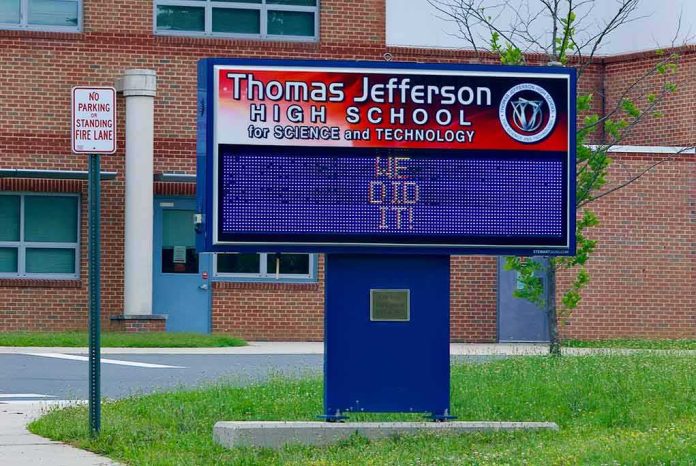 shutterstock_1989957131 Electronic school marquee in front of a brick high school
