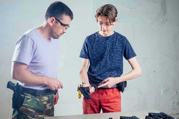 shutterstock_2057982611 Two people at a table handling a handgun with safety glasses on