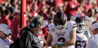 Did Oklahoma State Have Oregon’s Play Sheet? football coach and quarterback confer on sideline
