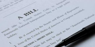 Bill document with pen on paper