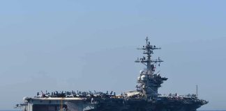 Aircraft carrier cruising at sea