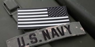 U.S. Navy patch and monochrome American flag patch on green gear