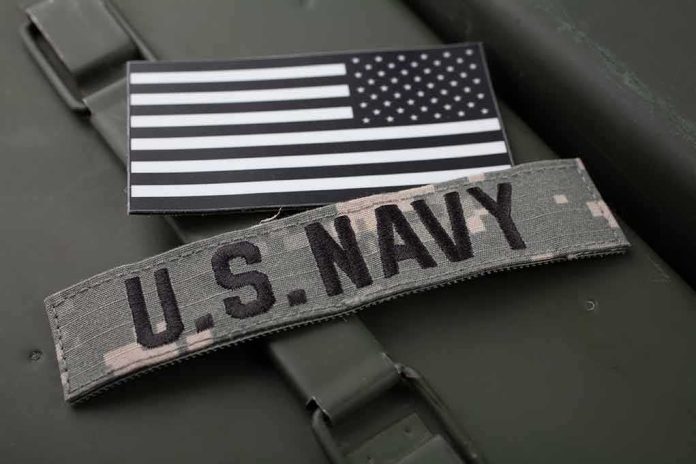 U.S. Navy patch and monochrome American flag patch on green gear