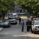 Hero Cop’s Daring Rescue Caught On Camera Police officers secure a residential street with patrol cars and yellow tape