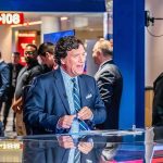 Tucker Carlson’s ‘Antichrist’ Accusation Goes Viral Tucker Carlson at a broadcast desk in a busy studio