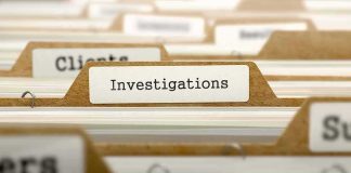 File folder tab labeled Investigations in a row of manila folders