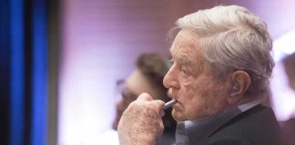 ‘Money Out of Politics’ Candidate Has a Soros Problem George Soros in profile, holding a pen to his lips during an event