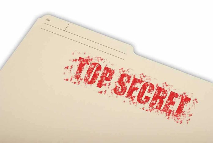 shutterstock_37530676 Manila file folder stamped TOP SECRET in red