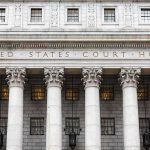 Blue States Block Fraud Checks — DOJ Strikes United States courthouse facade with Corinthian columns