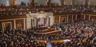 NJ Lt. Governor Under Investigation Legislative chamber filled with attendees during a formal address