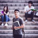 Parental Rights Showdown Hits Classrooms Student holding notebooks on campus steps