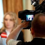 Democrat Calls Out ABC, CBS Over Talarico Interview tv camera films interview with blurred speaker