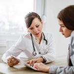 Your EYES Could Reveal a Hidden Heart Problem Doctor consulting a patient at a desk