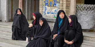 UK Taxpayers Fund Nearly 1,000 Hijabs Zahra Rahnavard among women in black chadors sitting on stone steps