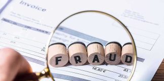 Trump’s Fraud Crackdown Targets POLITICIANS Magnifying glass highlighting wooden blocks spelling fraud on an invoice
