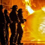 Military Training Ends in DEADLY Inferno Firefighters battling a large blaze with a hose