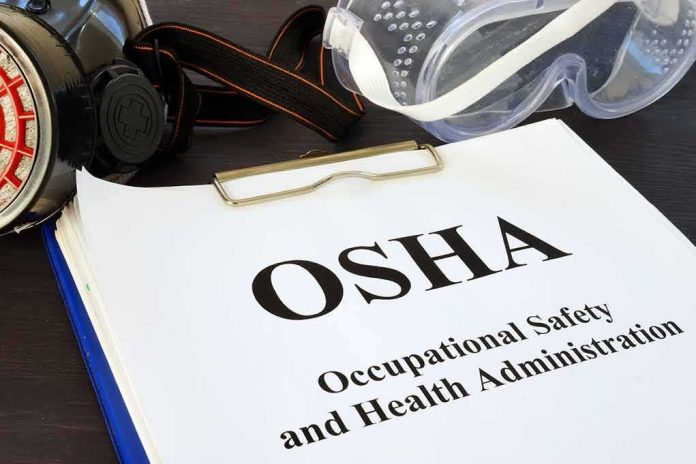 shutterstock_1165019521 OSHA document with safety goggles and respirator on desk