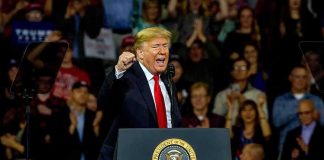 Trump Signs SURPRISE Diesel Order at Rally Donald Trump speaking at a rally behind a presidential podium