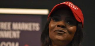 Candace Owens WINS Round Against the Macrons woman in a red cap speaking into a microphone