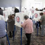 Trump’s 1-Word Verdict on California’s LEADERS Voters fill out ballots at polling booths in a busy voting room
