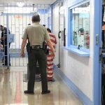 Supreme Court Takes Up INDEFINITE Detention Fight Corrections officers escort an inmate in a jail hallway