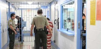 Supreme Court Takes Up INDEFINITE Detention Fight Corrections officers escort an inmate in a jail hallway