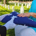 Folded American flag presented at a cemetery