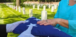 VA Funeral Benefits Leave Families With GAPS Folded American flag presented at a cemetery