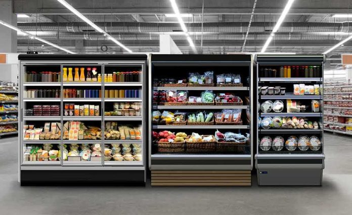 shutterstock_1690476982 Supermarket refrigerated display cases with drinks, produce, and prepared foods