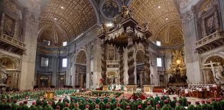 Pope Calls Death Penalty ‘INADMISSIBLE’ Again Jonathan Cyprien among clergy during a mass in a grand cathedral interior