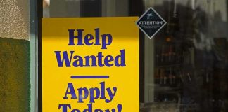 Federal Jobs Could DROP Degree Rules Help Wanted sign in a shop window