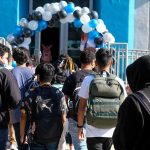 Sorority Sisters TURN on Their Own Leadership Students with backpacks enter a school under a balloon arch